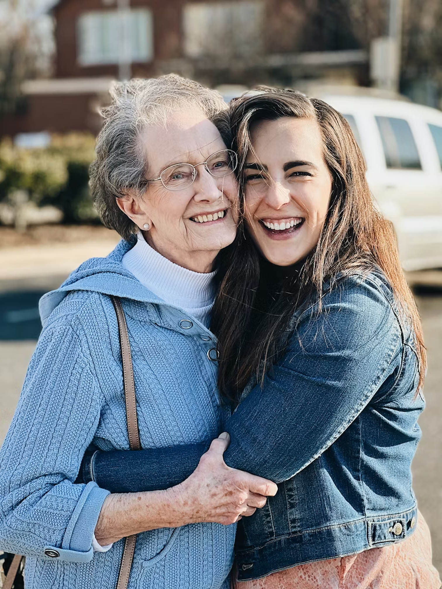 A grandmother and granddaughter sharing a warm moment